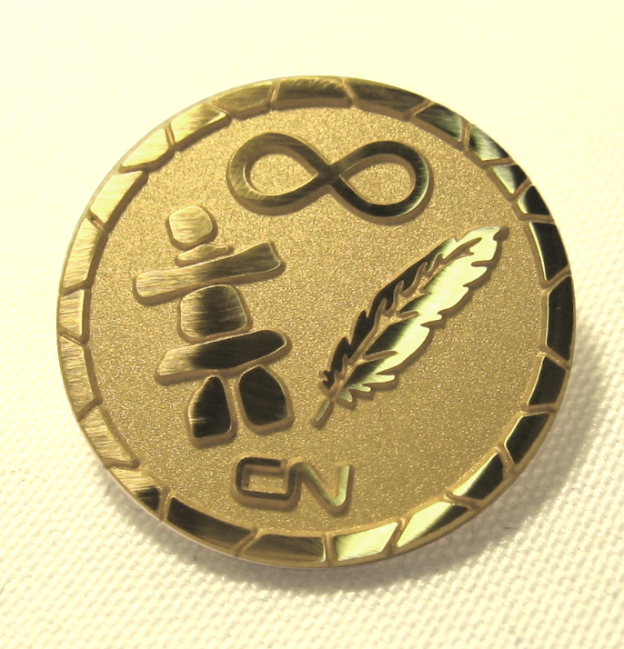 Photo of a gold plated lapel pin